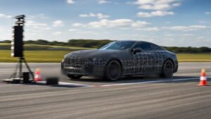 Editorial automotive image showing unbranded performance car accelerating on a closed test track for The Complete Guide to Acceleration and Speed Profiles: What Every Driver Should Know